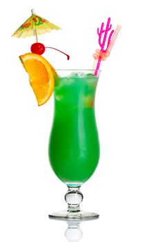 Green alcohol cocktail with orange slice and umbrella isolated on white background