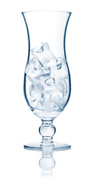 Highball cocktail glass full of ice cubes isolated on white background