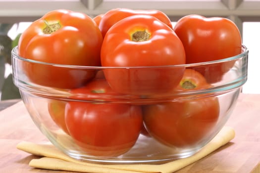 fresh healthy delicious organic  tomatoes  on clear bowl ,organic vegetarian food 