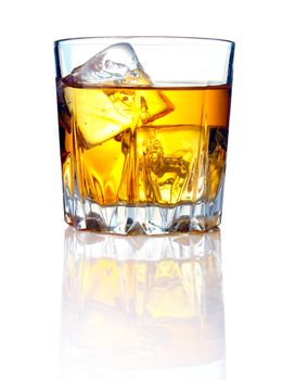 Whiskey glass with ice cubes and reflections