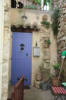 House in typical provencal style in France, windows with wooden shutters