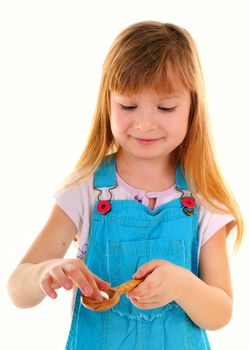 Small beauty girl with one big white tablet in wooden spoon on white background