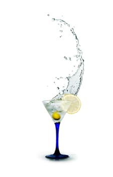 Stylish martini glass with splashing liquid and olives on white background