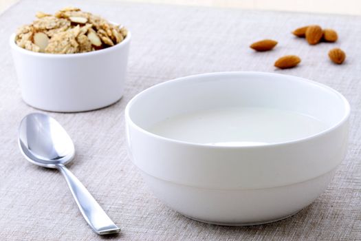 healthy almonds and riceflakes cereal with milk, part of a healthy nutrition program