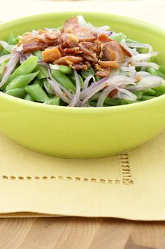 A holiday green bean casserole recipe, made with green beans, bacon or pancetta and sauteed shallots.