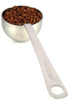 fresh instant gourmet coffee scoop isolated against white background