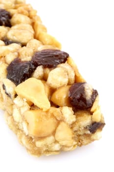 fresh homemade wholegrain whole wheat raisins and nuts cereal bar, with lots of assorted healthy ingredients  