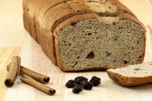 fresh baked  wholegrain whole wheat raisins and nuts bread with lots of assorted healthy ingredients   