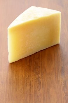 named after an area in Italy parmigiano reggiano or parmesan cheese is one of the world's most famous and delicious cheeses.
 shallow d.o.f