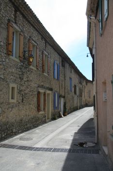 Narrow street in a small village in the Provence, France