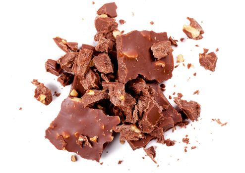Top view of pieces of chocolate over white background
