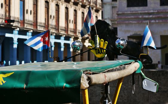 close up to the roof of bici taxi with cuban small flags  in Havana