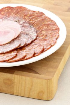 Classic delicious pizza ingredients on wood cutting board 