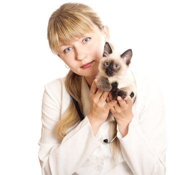 Woman veterinarian holding a fluffy kitten