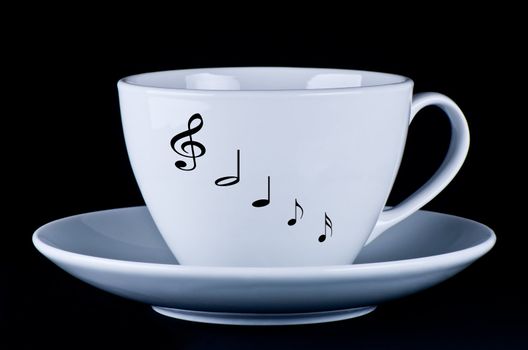 White mug with notes on a black background