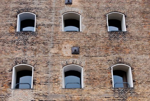 Old brick building with windows in a row