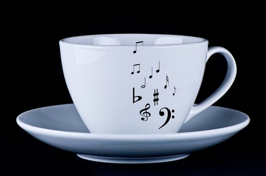 White cup with black musical notes  black background