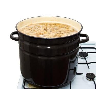 Mushrooms cook in a pan