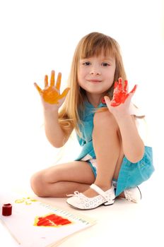 Small playful beauty girl with many-coloured hands and painted home on white background