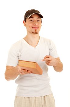 Smiling young casual men show a book by finger. On white background. Focus on men's eyes.