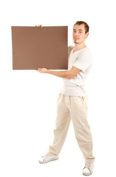 Young man shows by finger on a brown empty board for your text