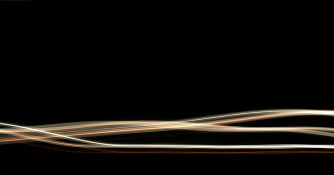 Abstract white and orange lines on a black background.
