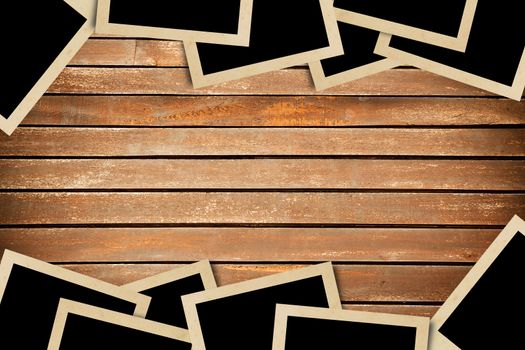 Blank photos frames on wood background