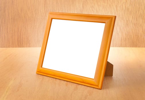 Photo frames on the table and wood background