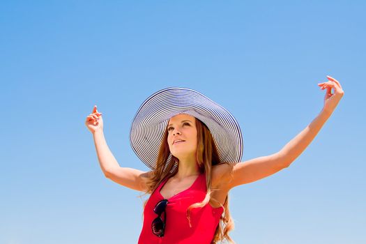 happy young beautiful girl  in the sky