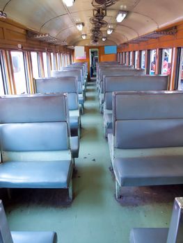 Inside of a vintage train passenger carriage in Thailand