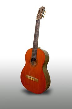 Classical acoustic guitar on grey background