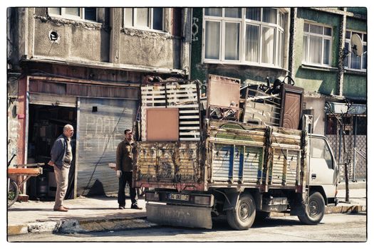 HEAVY LOADED TRUCK, ISTANBUL, TURKEY, APRIL 13, 2012: Scrap tradesman with high loaded truck in the Eyup area.