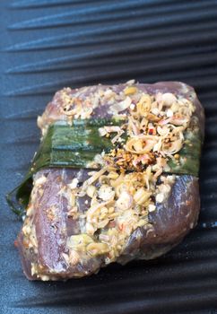 Closeup of nicely decorated tuna fish steak cooking on a grill