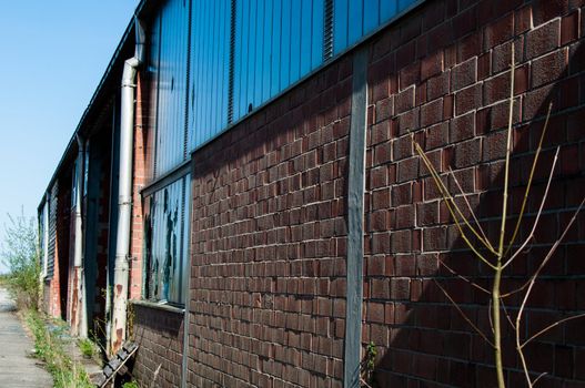 Rundown and abandoned factory with broken windows