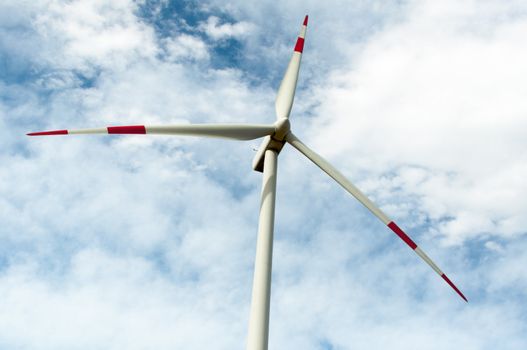 close-up portrait of wind turbine in blue sky