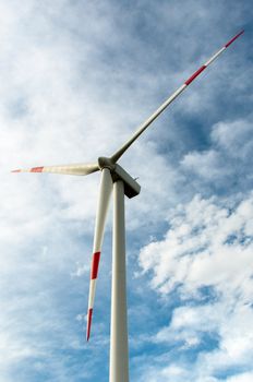close-up portrait of wind turbine in blue sky