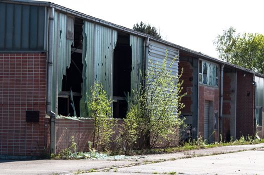 Rundown and abandoned factory with broken windows