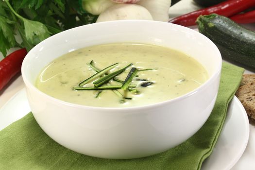 a bowl of zucchini creme soup with fresh julienne