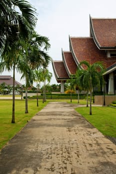 walkway in temple with palm trees
