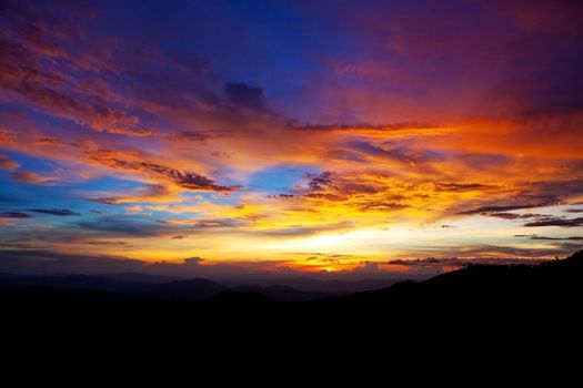 sunset in the mountains as background