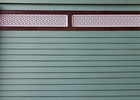 An green painted wall of the house