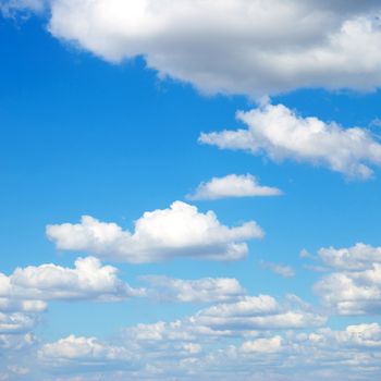 blue sky background with tiny clouds