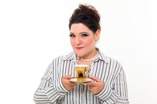 Pretty plus size woman with gold cup of coffee