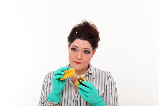 Woman in carrier cleaning a gold mug