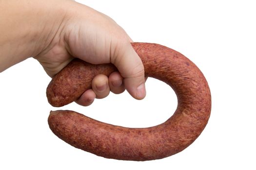 sausage in his hand on a white background