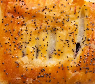 bun with poppy seeds as a background