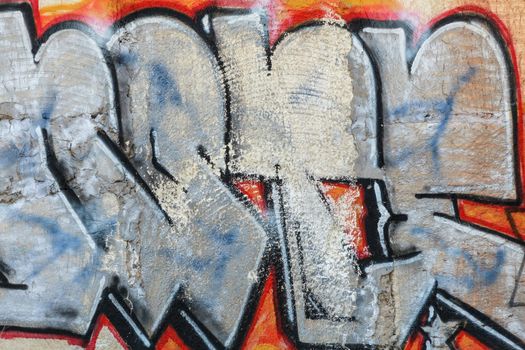 Graffiti on the old, peeling wall