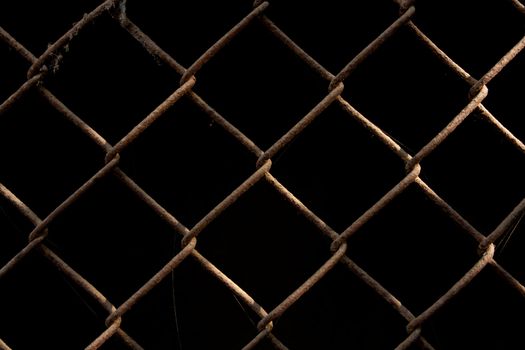 rusty metal grid on a black background