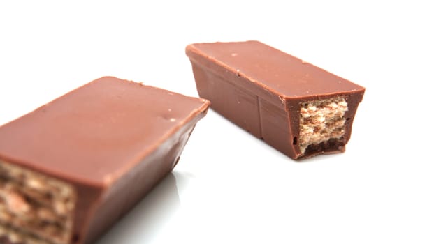 two candy bar pieces isolated on white 