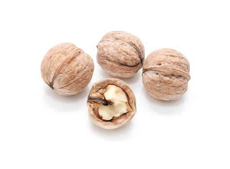 walnut and a cracked walnut isolated on the white background 